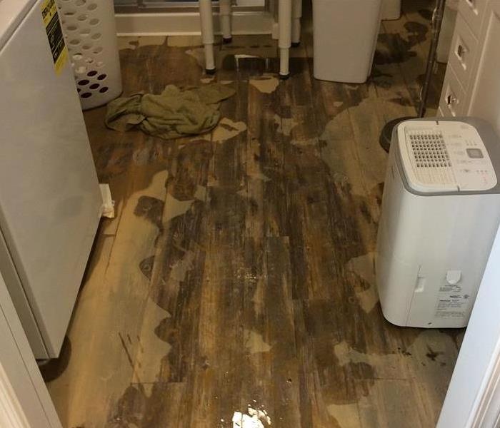 A photo of a floor with muddy water